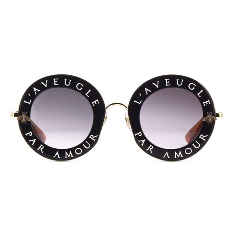 occhiali da sole gucci rotondi logo|Occhiali da sole rotondi in acetato nero e verde .